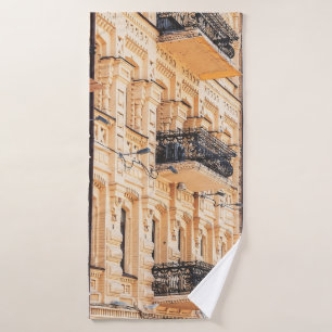 An old yellow house with wrought-iron balconies. f bath towel