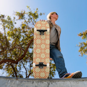 an orange and white background with a pattern skateboard
