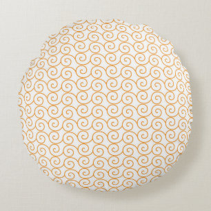 an orange and white background with swirls round cushion