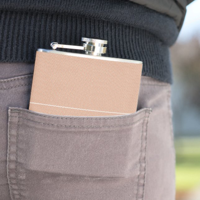 an orange and white geometric pattern hip flask (In Situ)