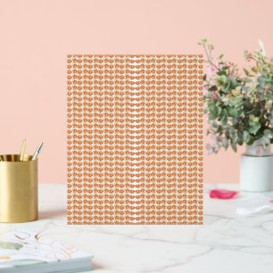 an orange and white pattern on a white background acrylic sign