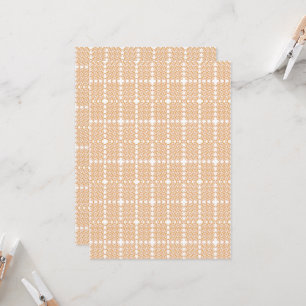 an orange and white wallpaper with a floral design invitation