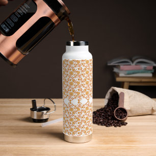 an orange and white wallpaper with a floral design water bottle