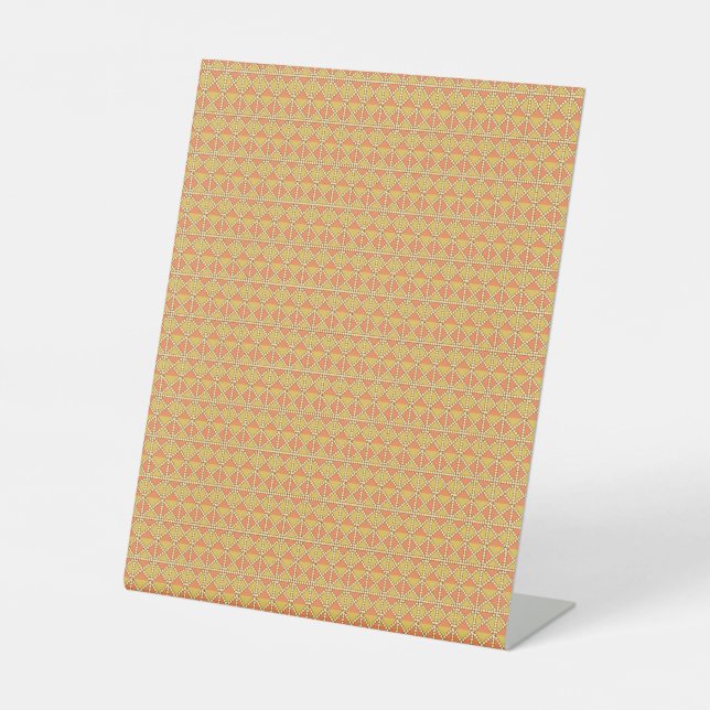 an orange and yellow background with a pattern pedestal sign (Front)