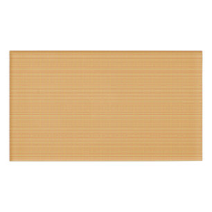 an orange and yellow background with small dots name tag