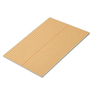 an orange and yellow background with small dots notepad