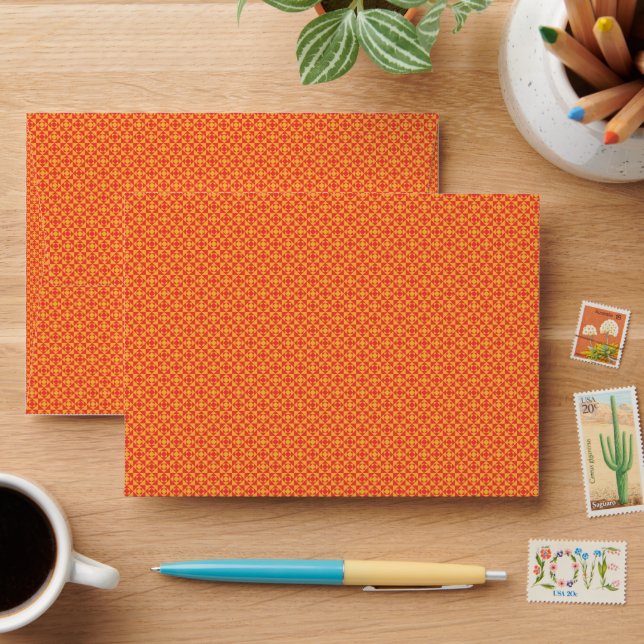 an orange and yellow background with small squares envelope (Desk)