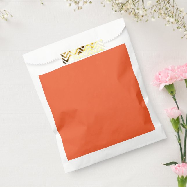 an orange background with a favour bag (Sealed)