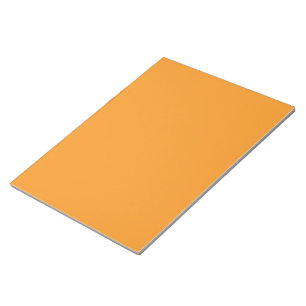 an orange background with a white border notepad
