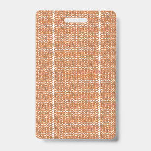 An orange rug with a textured pattern lies flat on ID badge
