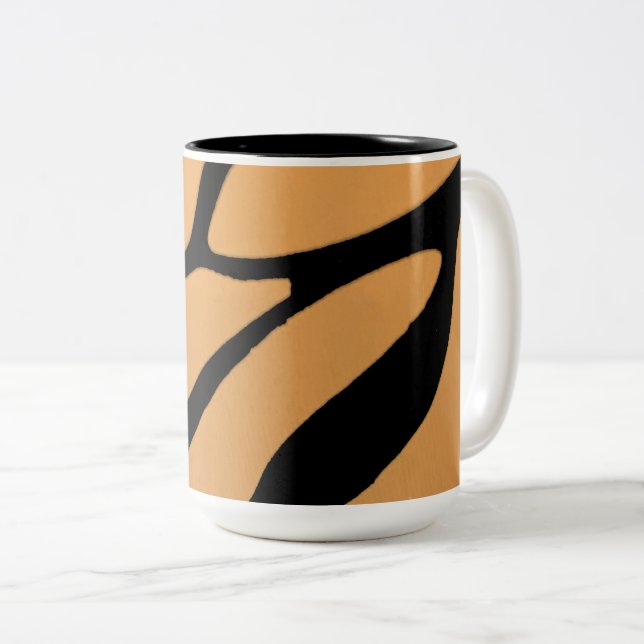  an orange surface with irregular black lines Two-Tone coffee mug (Front Right)