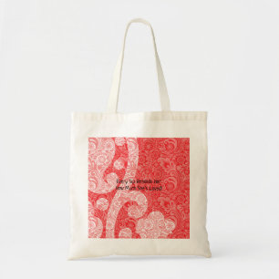 An ornate paisley design featuring rich red and bl tote bag