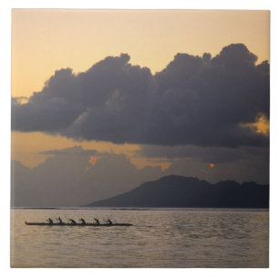 An outrigger canoe team practices off the coast ceramic tile