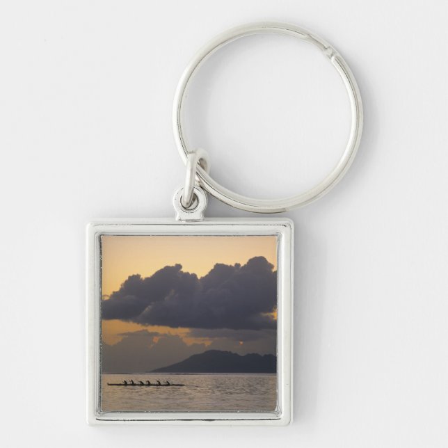 An outrigger canoe team practices off the coast key ring (Front)