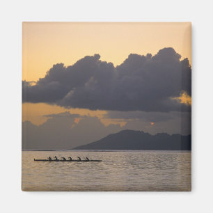 An outrigger canoe team practices off the coast magnet