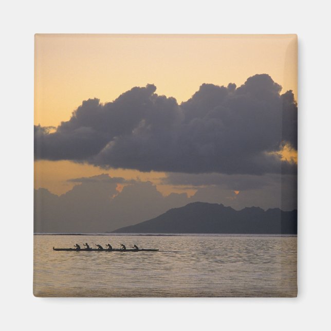 An outrigger canoe team practices off the coast magnet (Front)