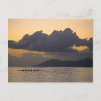 An outrigger canoe team practices off the coast