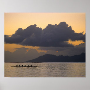 An outrigger canoe team practices off the coast poster