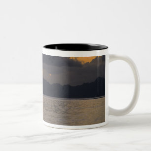 An outrigger canoe team practices off the coast Two-Tone coffee mug