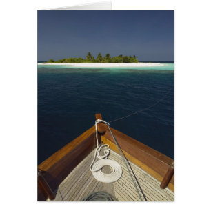 Anchored Boat Approaching Island