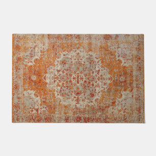 Ancient orange oriental carpet doormat