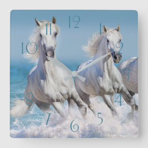 Andalusian white horses run in the waves square wall clock