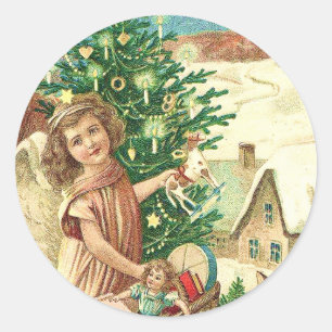 Angel bringing Christmas gifts and presents Classic Round Sticker