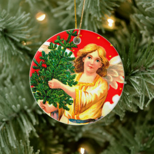 Angel in Yellow Carrying Xmas Tree Ceramic Ornament