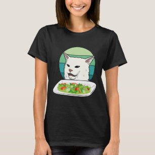 Angry women yelling at confused cat at dinner tabl T-Shirt