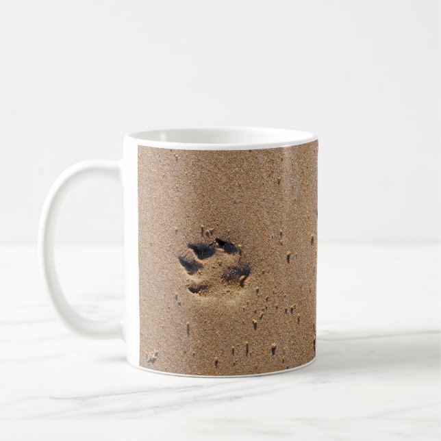 Animal paw prints in sand coffee mug (Left)