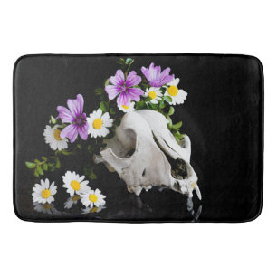 Animal skull with a wreath of wild flower bath mat