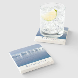 Antarctica iceberg landscape photo with white text stone coaster