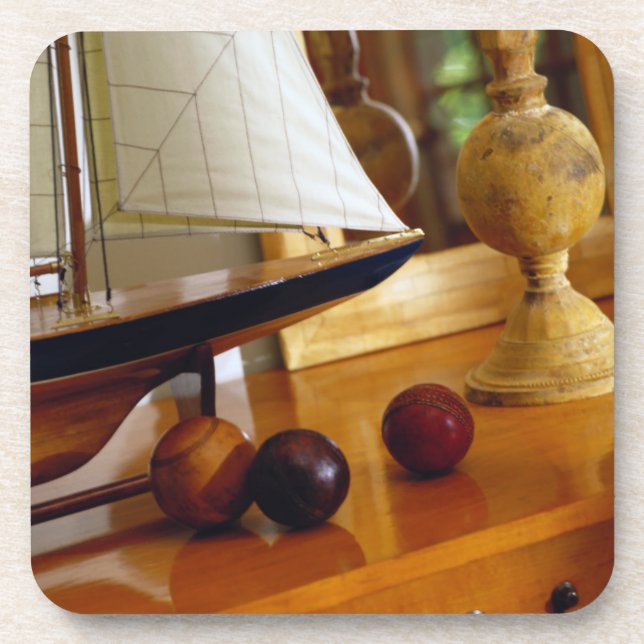 Antique Baseballs On A Table By A Model Sailboat Coaster (Front)
