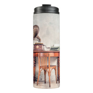 Antique chair, old typewriter, retro radio, gramop thermal tumbler