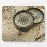 Antique compass on map