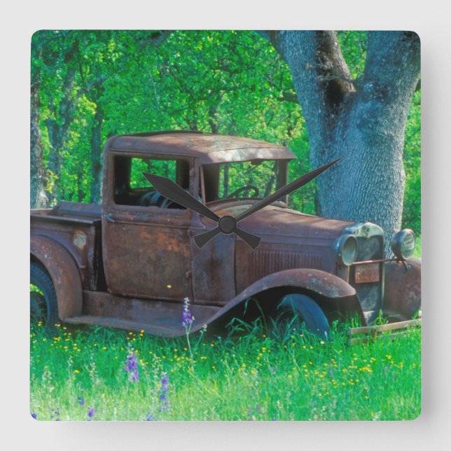 Antique rusted truck in a meadow square wall clock (Front)