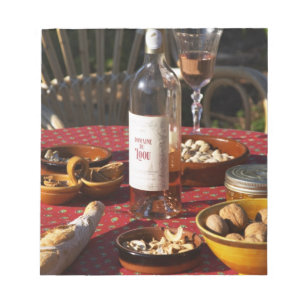 Aperitif and appetizers prepared: bread, olives, notepad