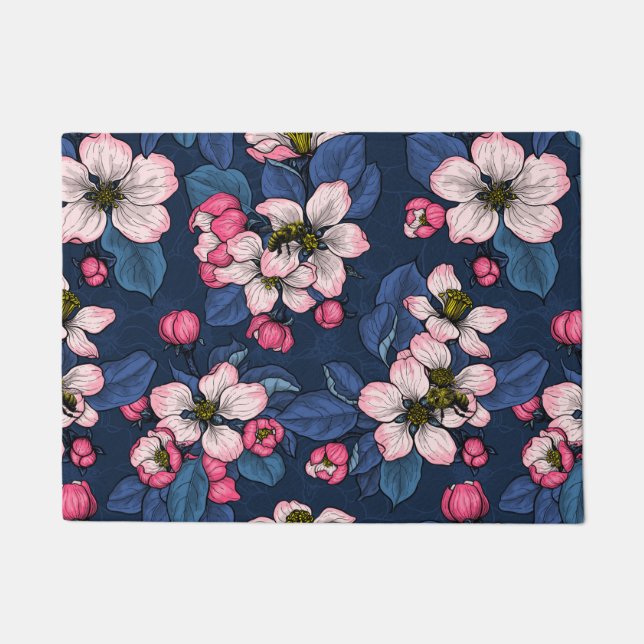 Apple blossom on a dark blue doormat (Front)