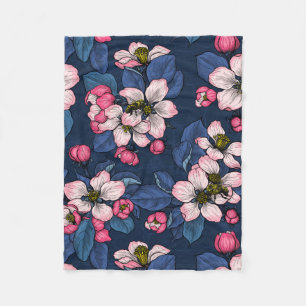 Apple blossom on a dark blue fleece blanket