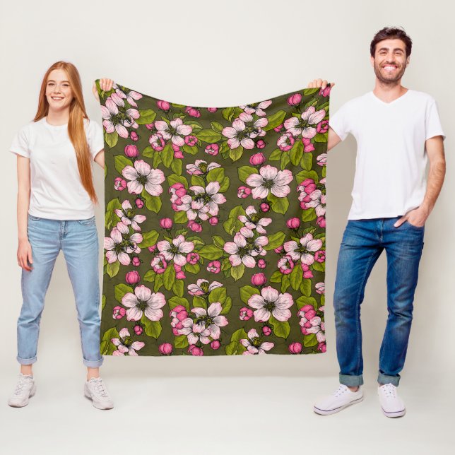 Apple blossom on dark green fleece blanket (In Situ)