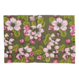 Apple blossom on dark green pillowcase