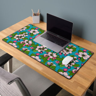 Apple blossom on turquoise desk mat
