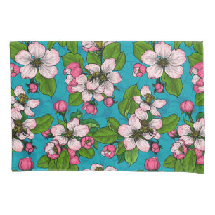 Apple blossom on turquoise pillowcase