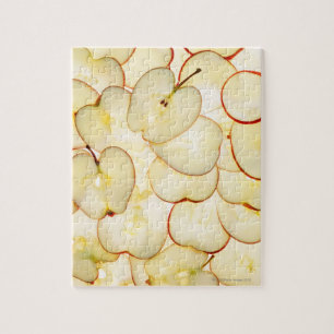 apple slices backlit and arranged in abstract jigsaw puzzle
