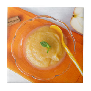 Applesauce with cinnamon and orange spoon ceramic tile
