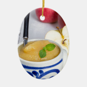 Applesauce with cinnamon in stoneware bowl ceramic tree decoration