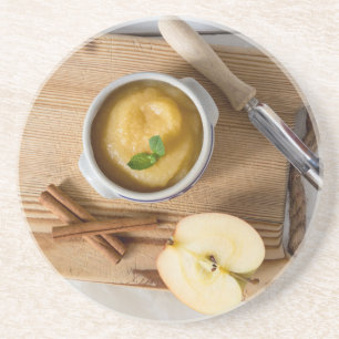 Applesauce with cinnamon in stoneware bowl coaster