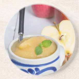 Applesauce with cinnamon in stoneware bowl coaster