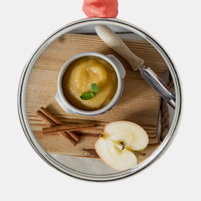 Applesauce with cinnamon in stoneware bowl metal tree decoration (Front)