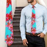 Aqua and Pink Hawaiian Plumeria Print Tie<br><div class="desc">Bright aqua blue tie with all-over print of hot pink Hawaiian plumeria blooms.  Tropical print is perfect for summer parties or beach weddings.  Feel free to change the background color in the 'customize' area.</div>